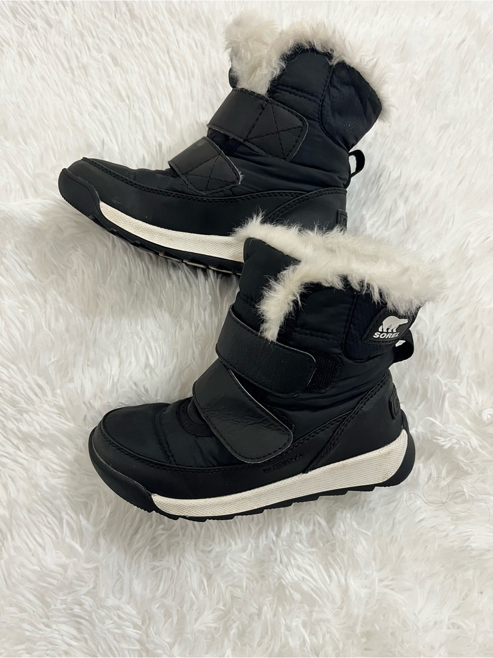 SOREL Kids black and white faux fur winter boots
